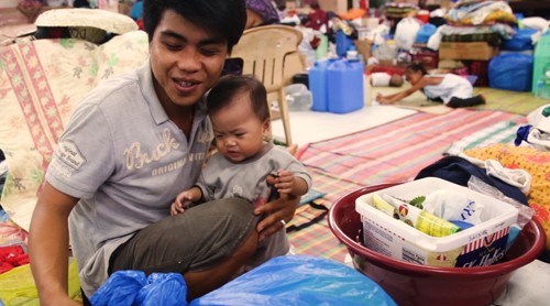 WATCH: A dad, a baby, and an evacuation center
